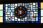 Cathedral’s Coat of Arms: Gospel and Sword with Vignettes of Beaver, Maple Leaf, and Trillium Flower from the Dean’s office windows of Cathedral’s Heraldic Arms and Vignette of Current Cathedral