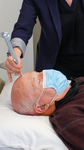 demonstrating 128Hz tuning fork vibration on forehead by Clinical Neurological Sciences, Schulich School of Medicine and Dentistry