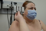 Nurse checking pupil size