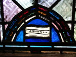 Detail, Inscription in Healing the Two Blind Men from Christ Healing the Sick and Poor window by Yvonne Williams and Esther Johnson